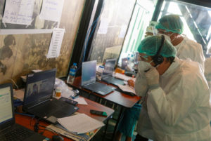 Representatives-of-UNOPS-and-WHO-meeting-with-positive-patients-via-a-virtual-call-300x201